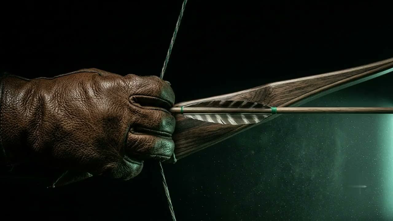 An archer at full draw in near darkness, side-lit by a cold green edge of light.